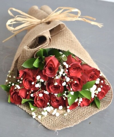 A dozen rose wrapped in burlap